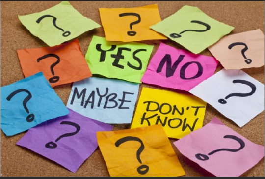 a set of colourful post it notes with question marks