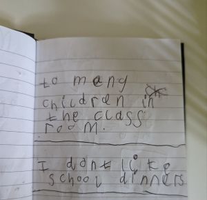 A picture of a child's writing stating too many children in classroom