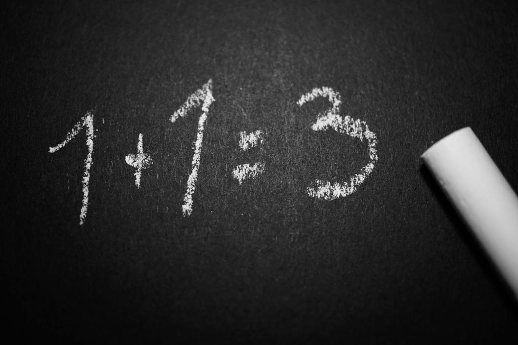 numbers 1 plus 1 = 3 written on a chalkboard