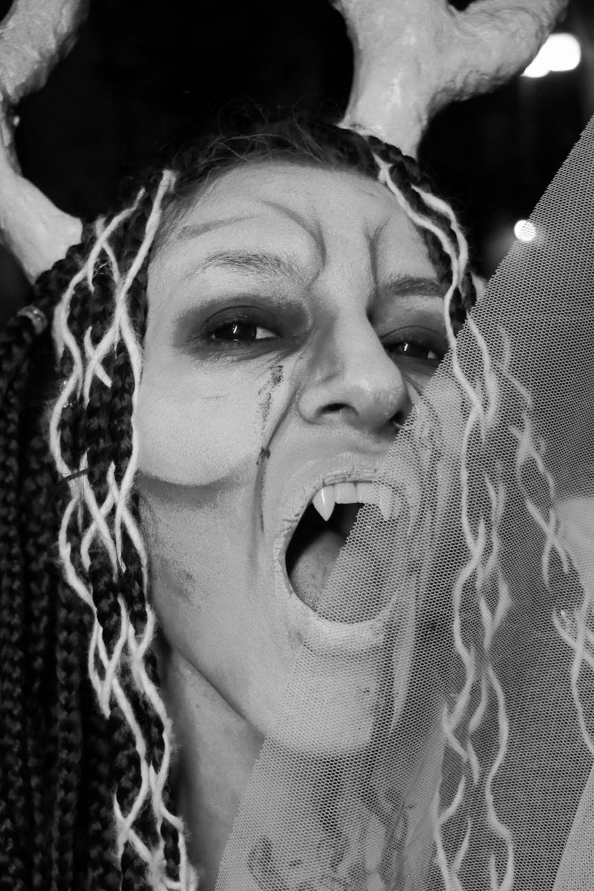 black and white vampire costume portrait with vampire teeth