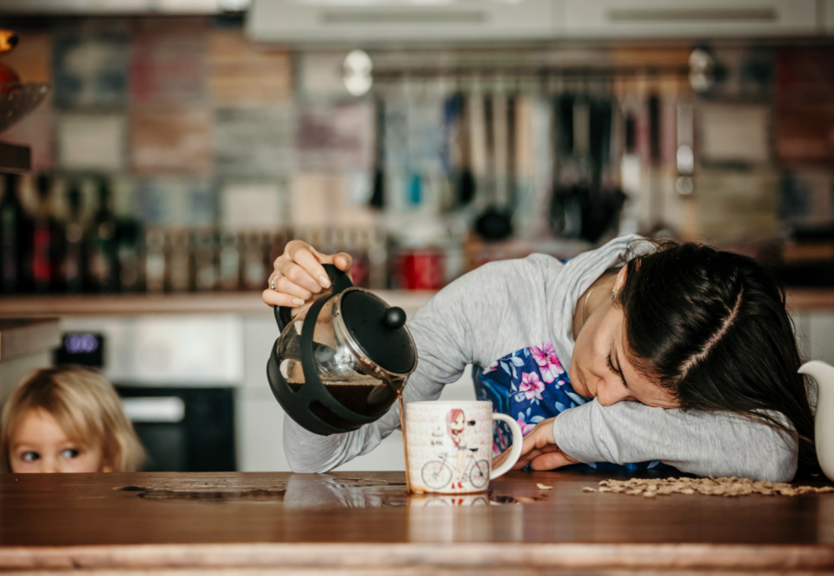 an image sowing parenting exhaustion with a tired parent pouring coffee
