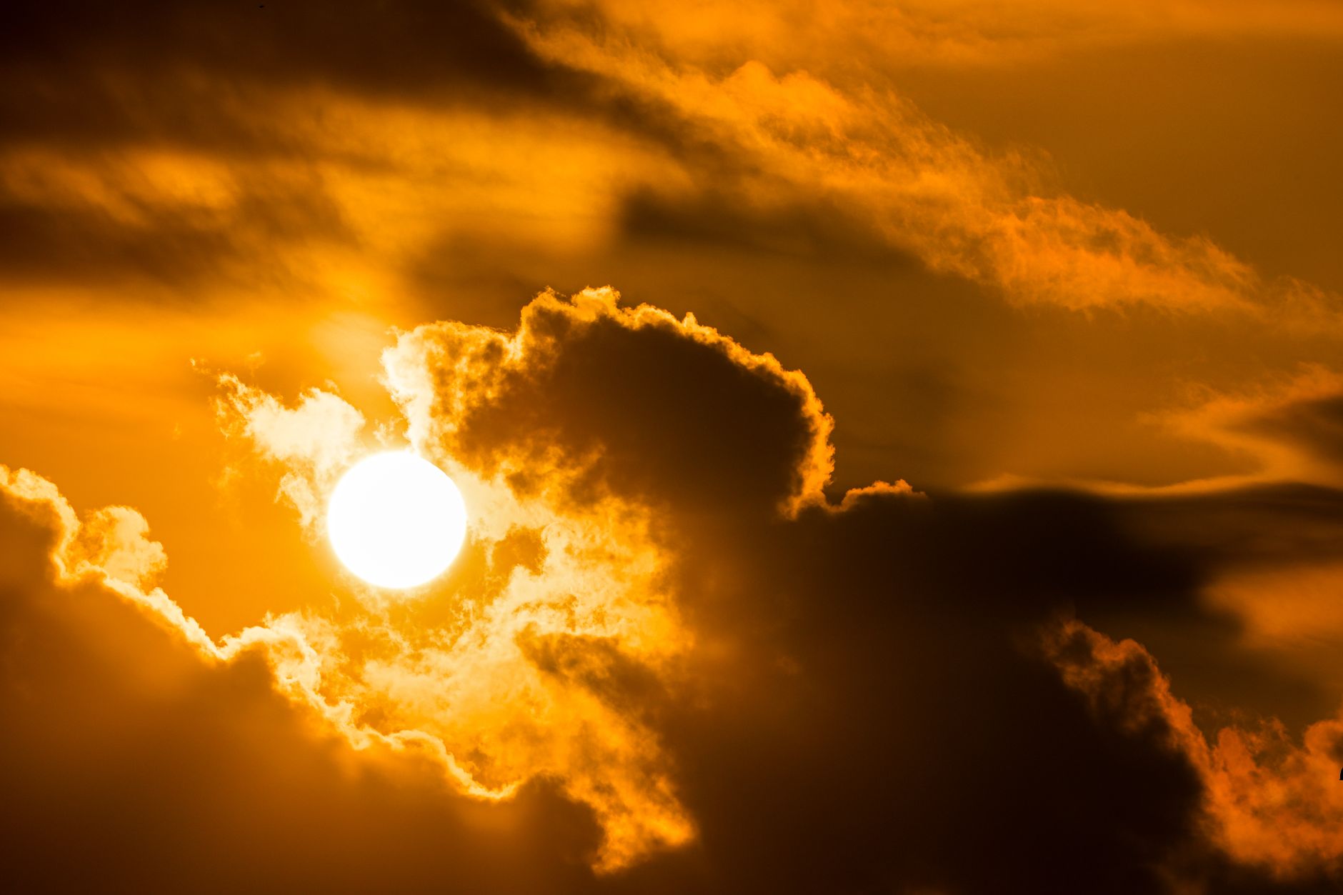does the sun melt away the clouds. a dramatic sun against the clouds
